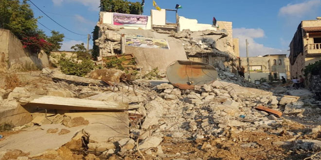 In a punitive measure, Israel occupation demolishes the family homes of two Palestinian detainees displacing 14 people