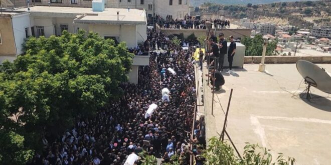 Occupied Syrian Golan citizens escort martyrs of massacre committed by Israeli occupation, Majdal Shams town to their final resting place